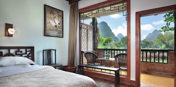 This spacious river view twin room is perfect for friends at Yangshuo Mountain Retreat.