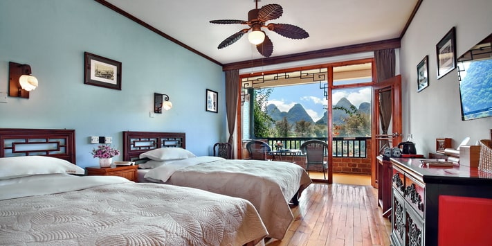 This spacious river view twin room is perfect for friends at Yangshuo Mountain Retreat.